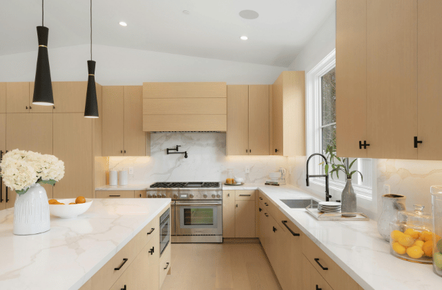 Refined traditional kitchen with marble countertops and wooden cabinets