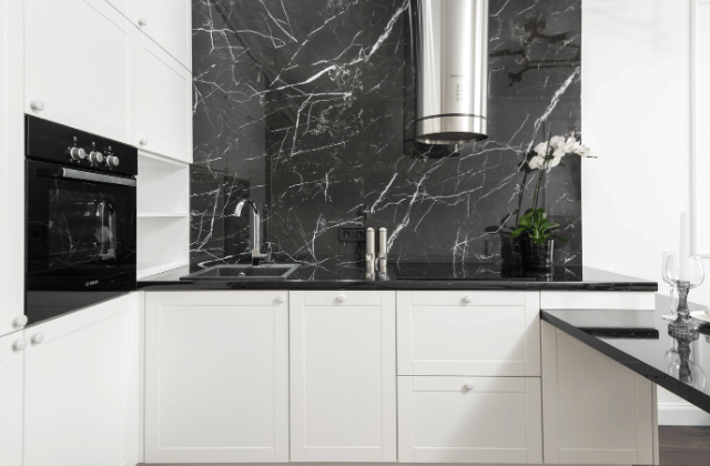 Sophisticated kitchen design with black marble and white veining